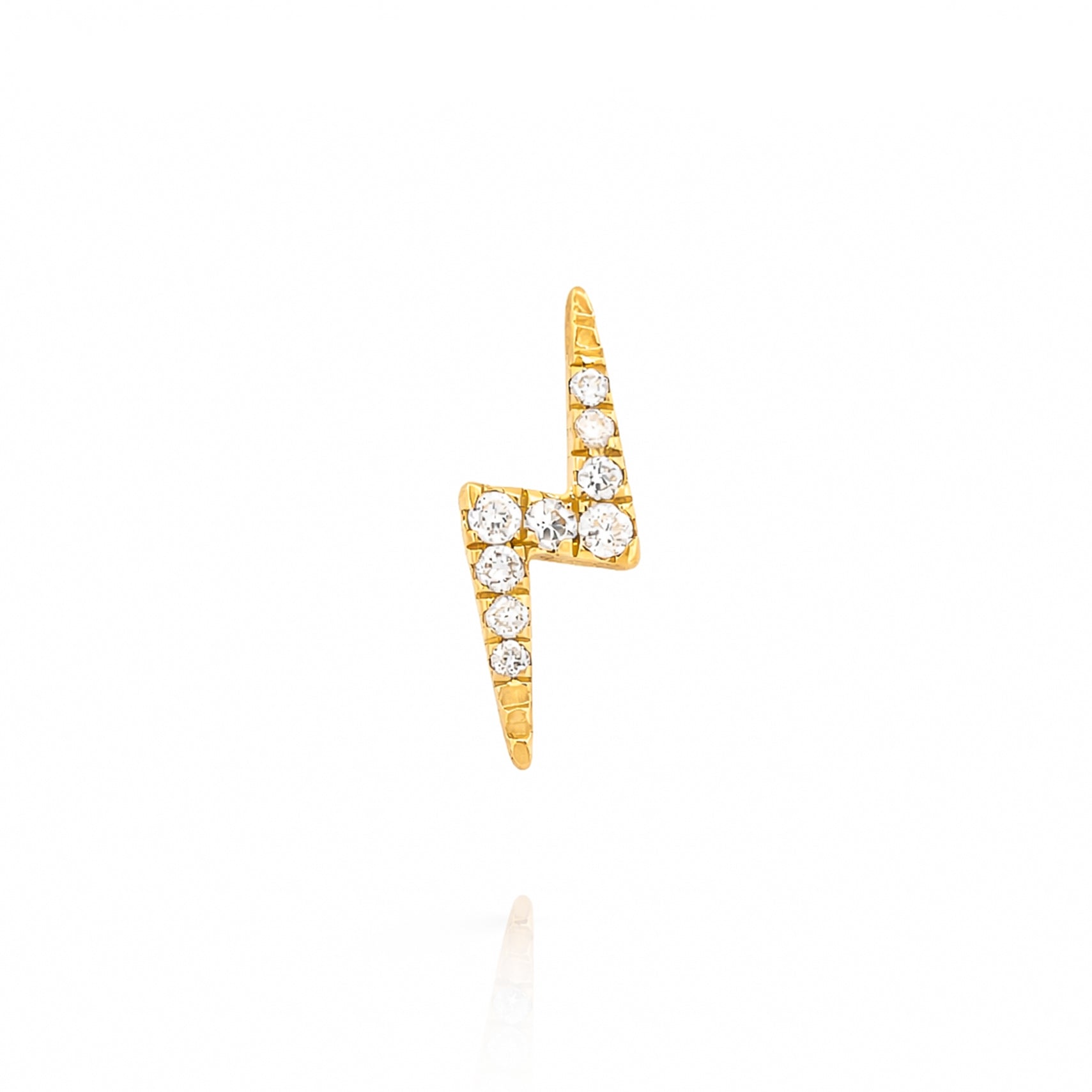 Gold lightning bolt earring with diamonds on a white background