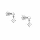 White gold earrings with round diamonds on a white background