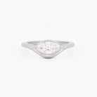 White gold solitaire ring with a marquise diamond on a white background.