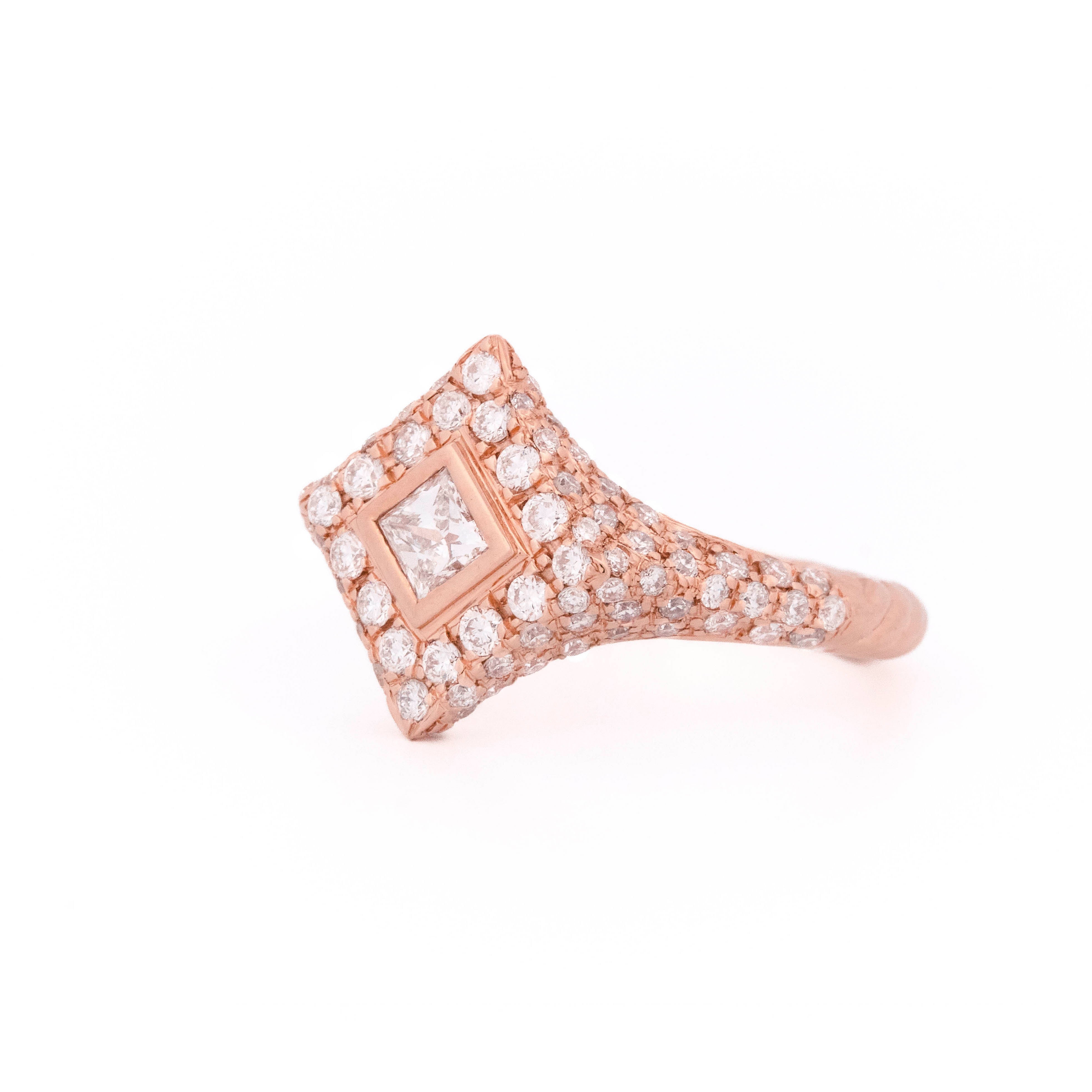 Rose gold ring with diamonds, rhombus and round shaped, on a white background