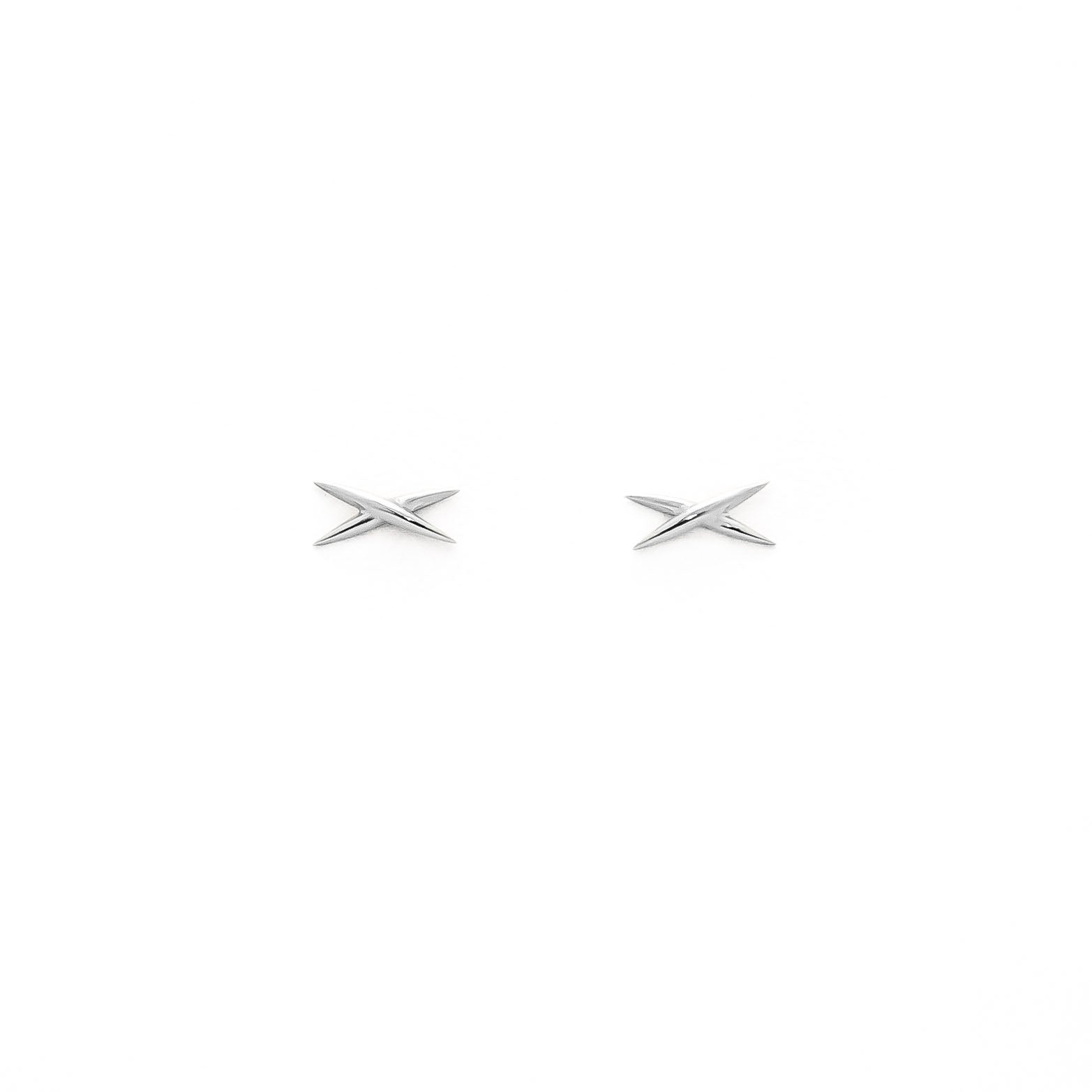 A pair of gold stud earrings shaped like an X on a white background.