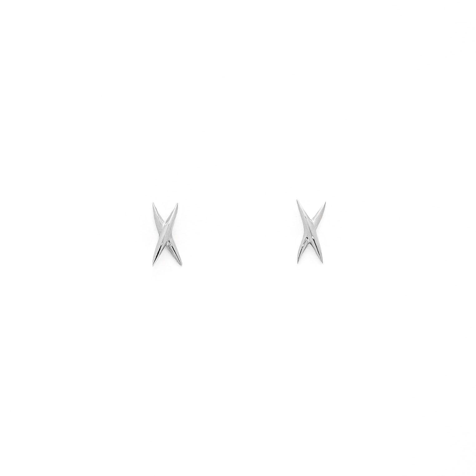 A pair of gold stud earrings shaped like an X on a white background.