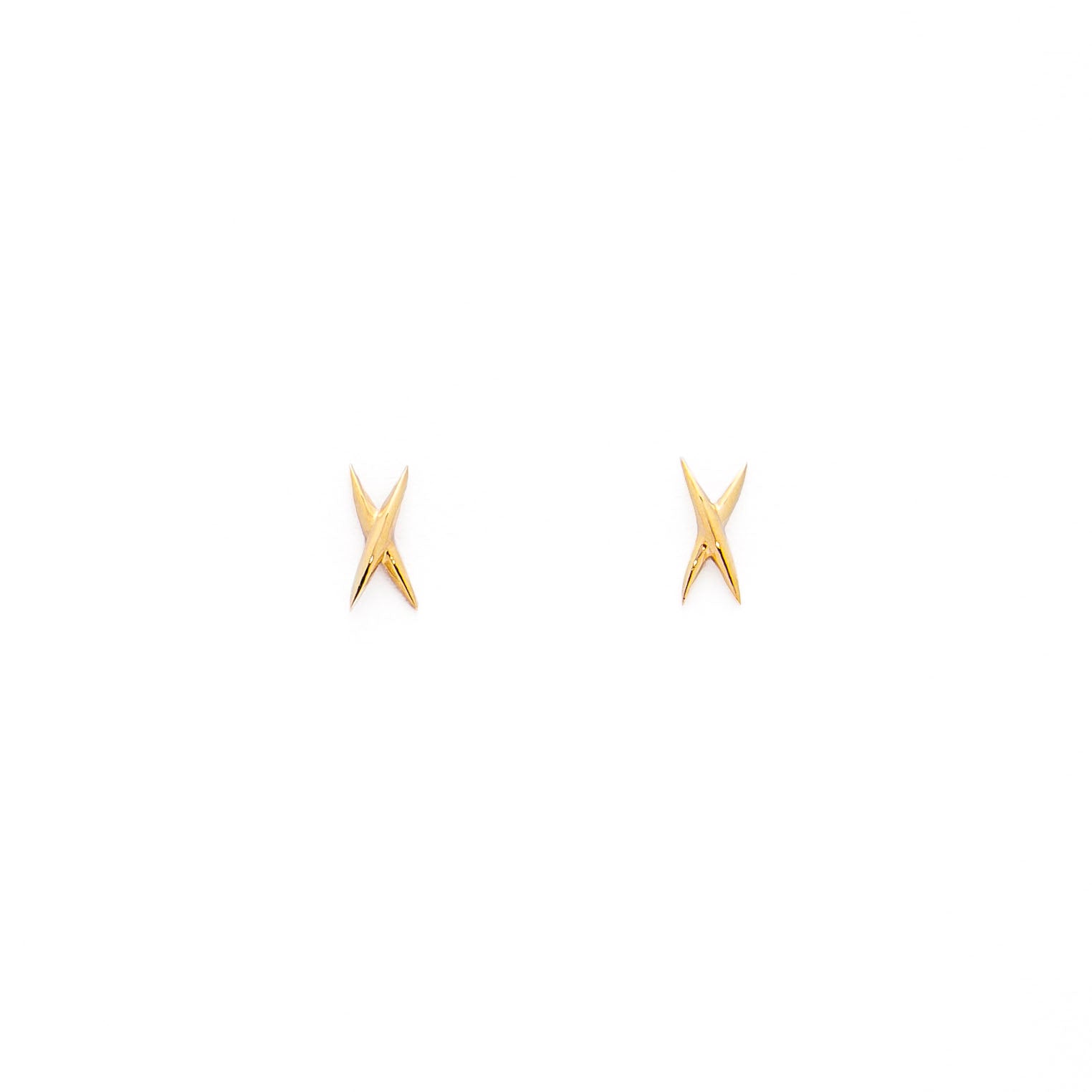 A pair of gold stud earrings shaped like an X on a white background.