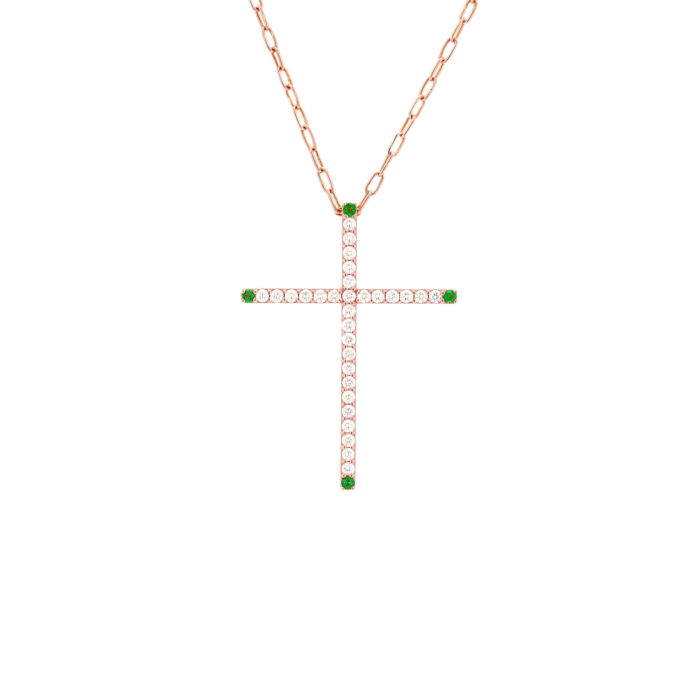 a gold cross pendant necklace with white diamonds and emeralds.