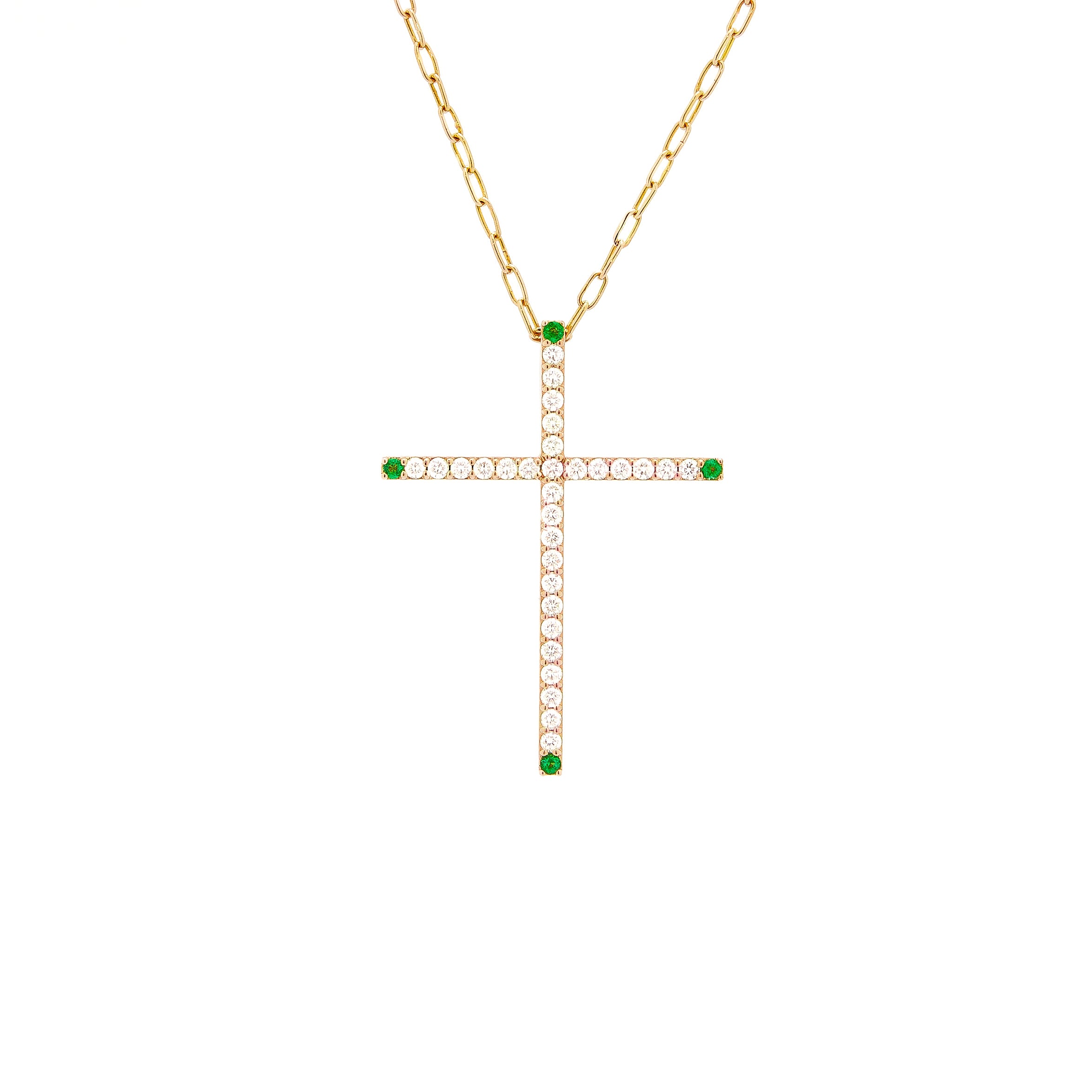 a gold cross pendant necklace with white diamonds and emeralds.