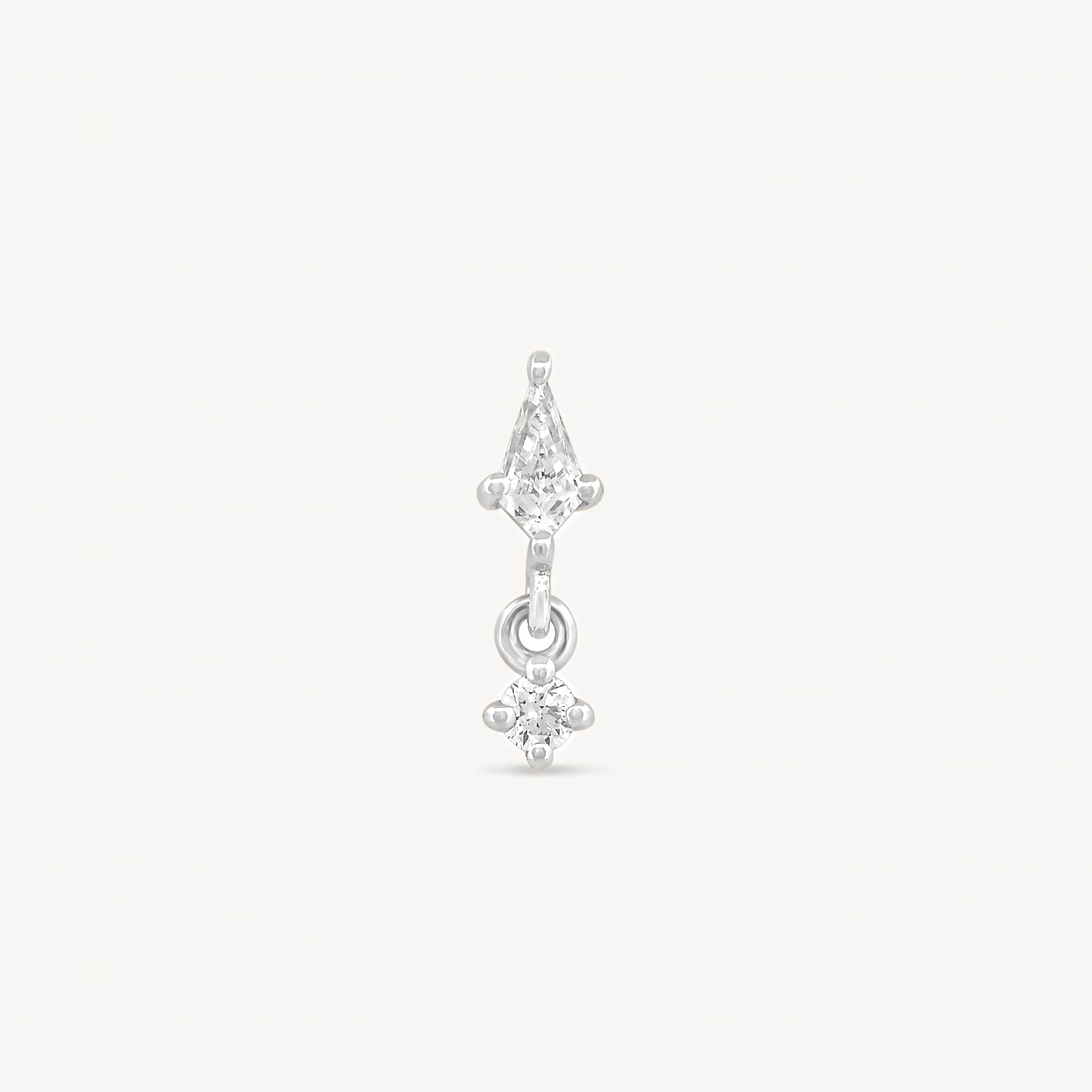 Kite and round diamonds stud earring with white gold on a light gray background