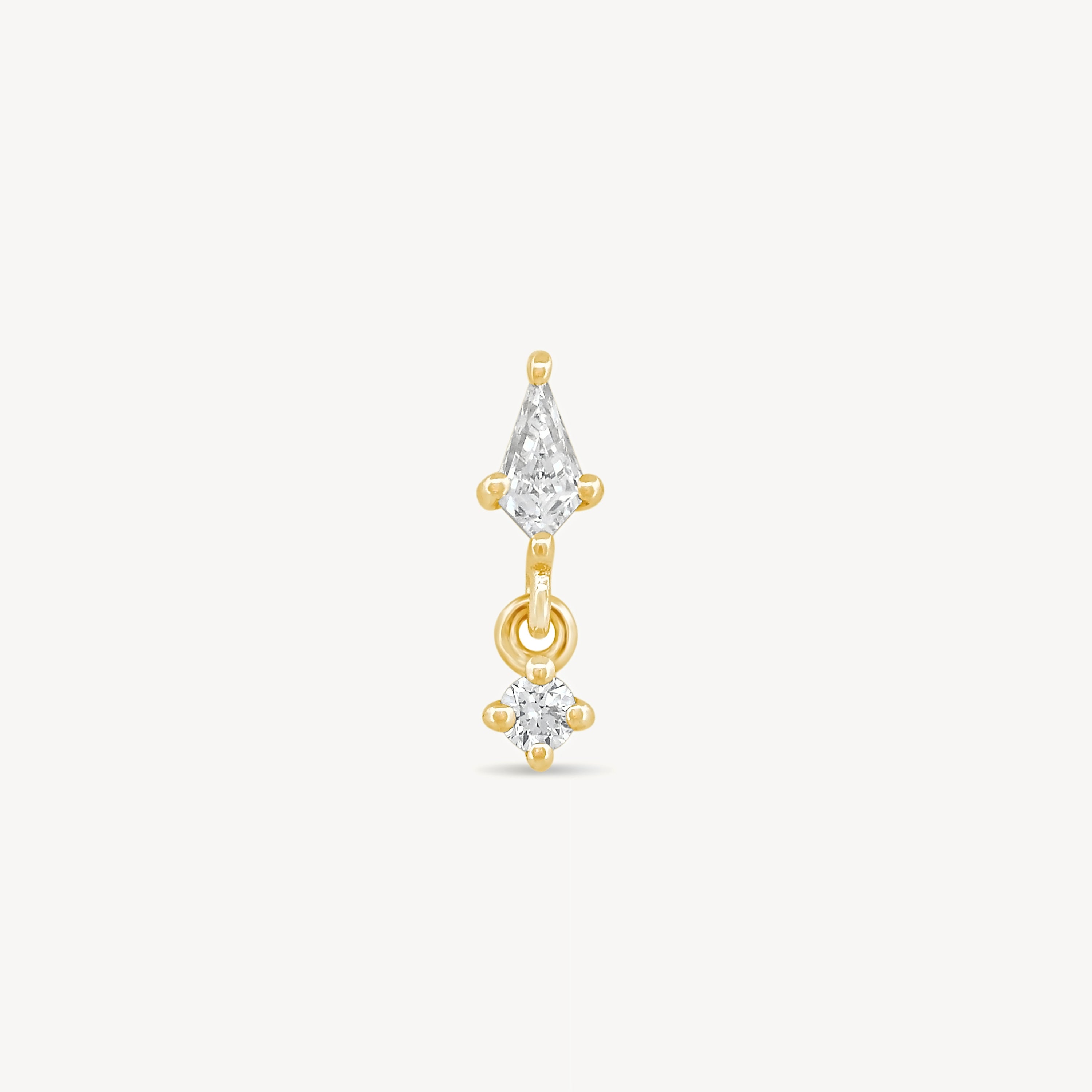 Kite and round diamonds stud earring with yellow gold on a light gray background