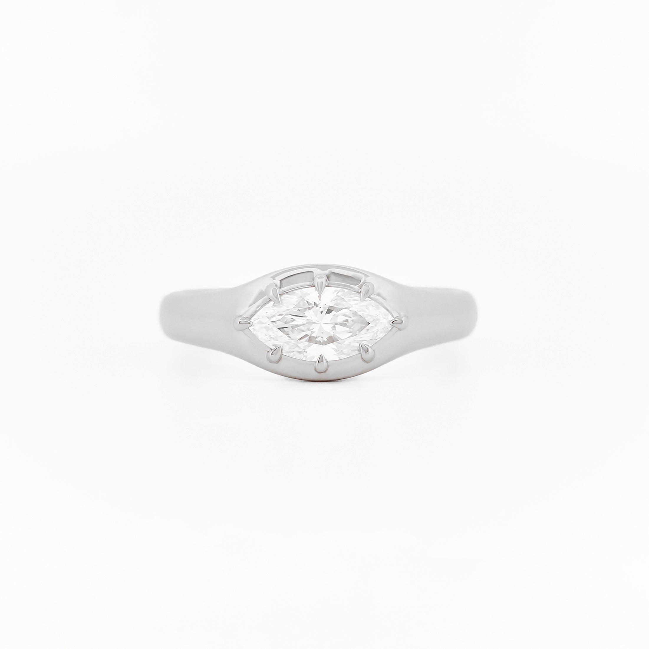 Signet Pinky Diamond ring, in white gold, on a with a white background