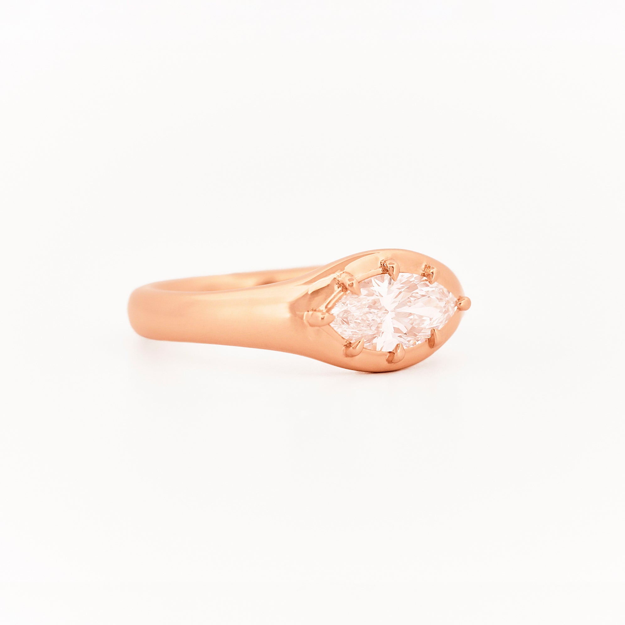 Signet Pinky marquise Diamond ring, in rose gold, on a with a white background