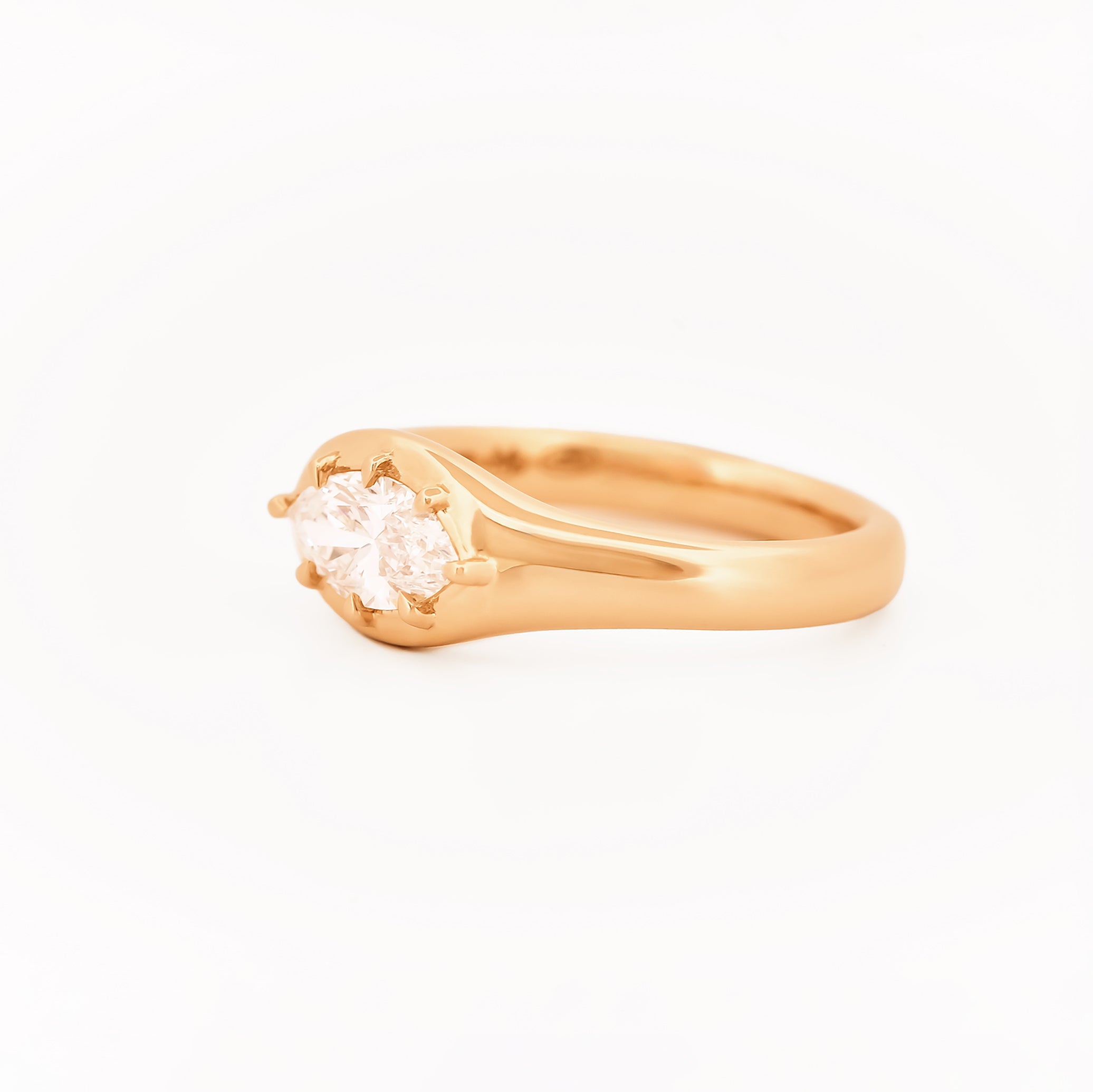 Signet Pinky Marquise Diamond ring, in yellow gold, on a with a white background