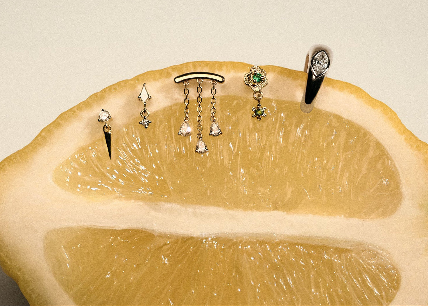 stud earrings set displayed on a sliced lemon