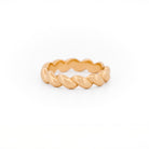 Yellow Gold ring with a braided design on a white background