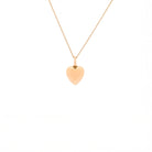 Gold heart-shaped pendant necklace on a white background