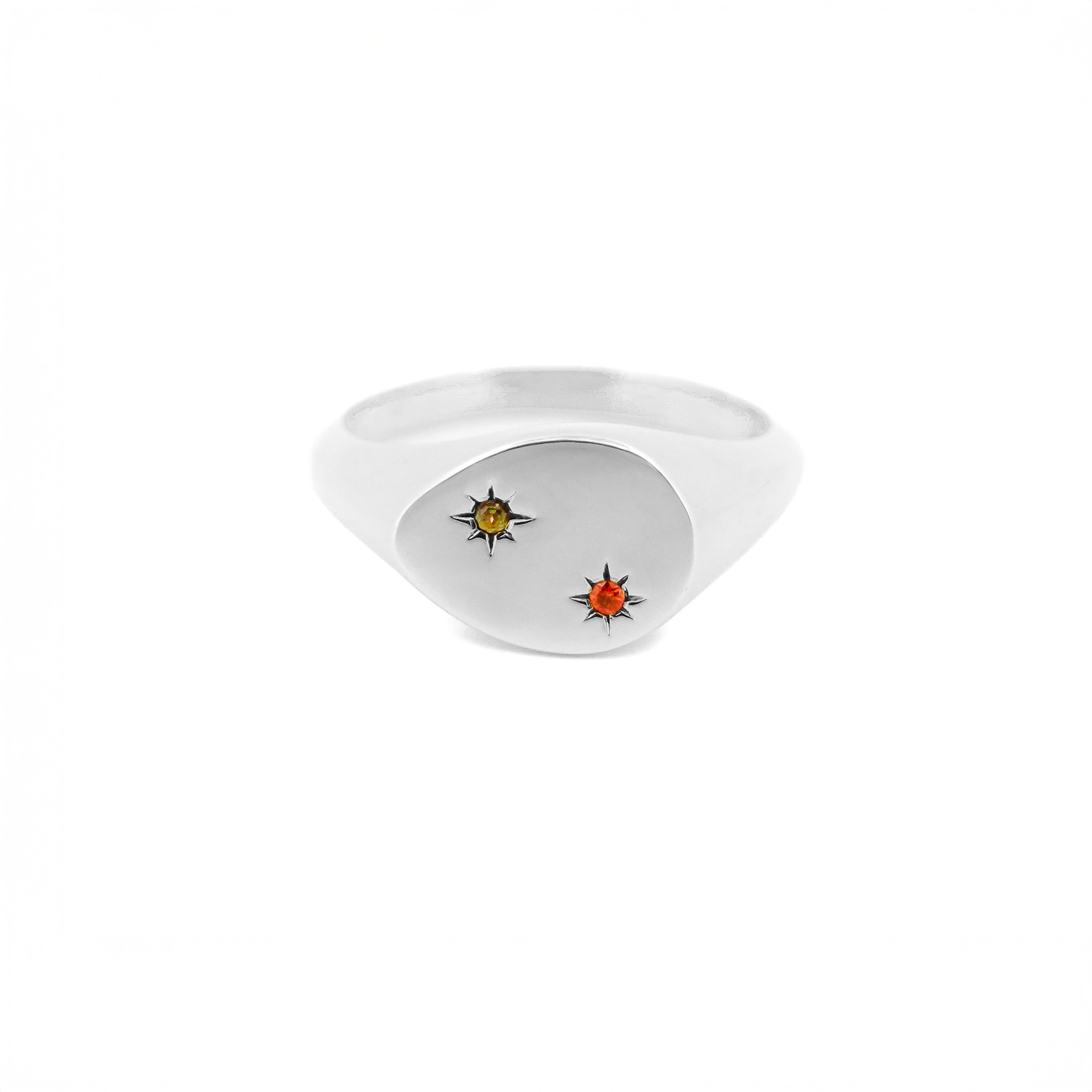 Gold ring with embedded gemstones on a white background, the stones are set inside 2 stars