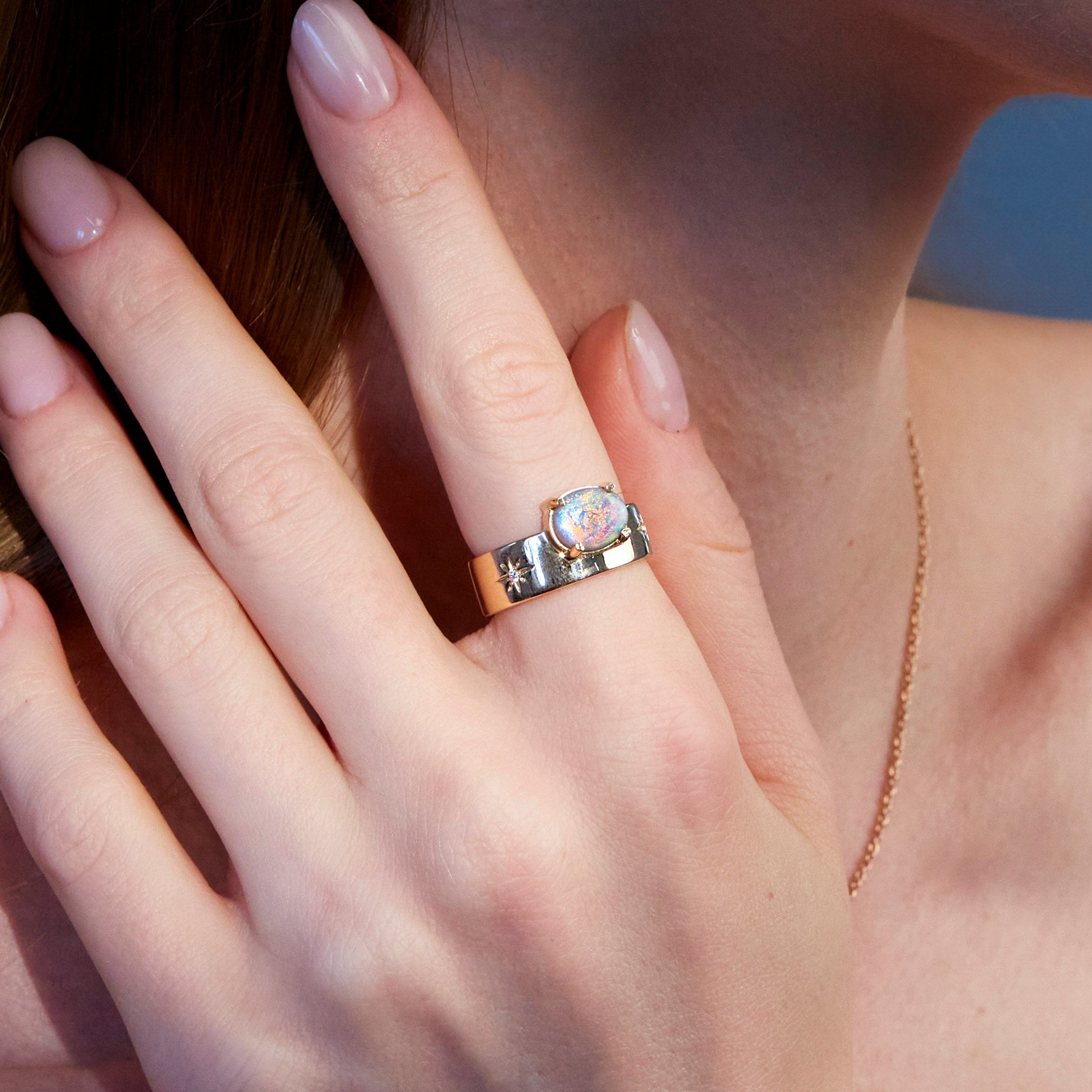 australian opal band ring in rose gold on hand 
