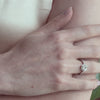 hexagon diamond ring on hand.