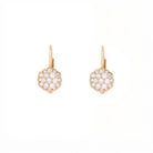 Pair of gold earrings with a flower made of diamonds on a white background