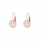 Pair of rose gold earrings with a flower made of diamonds on a white background