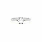 Ring with a large central rose-cut diamond and smaller side diamonds on a white gold band against a white background